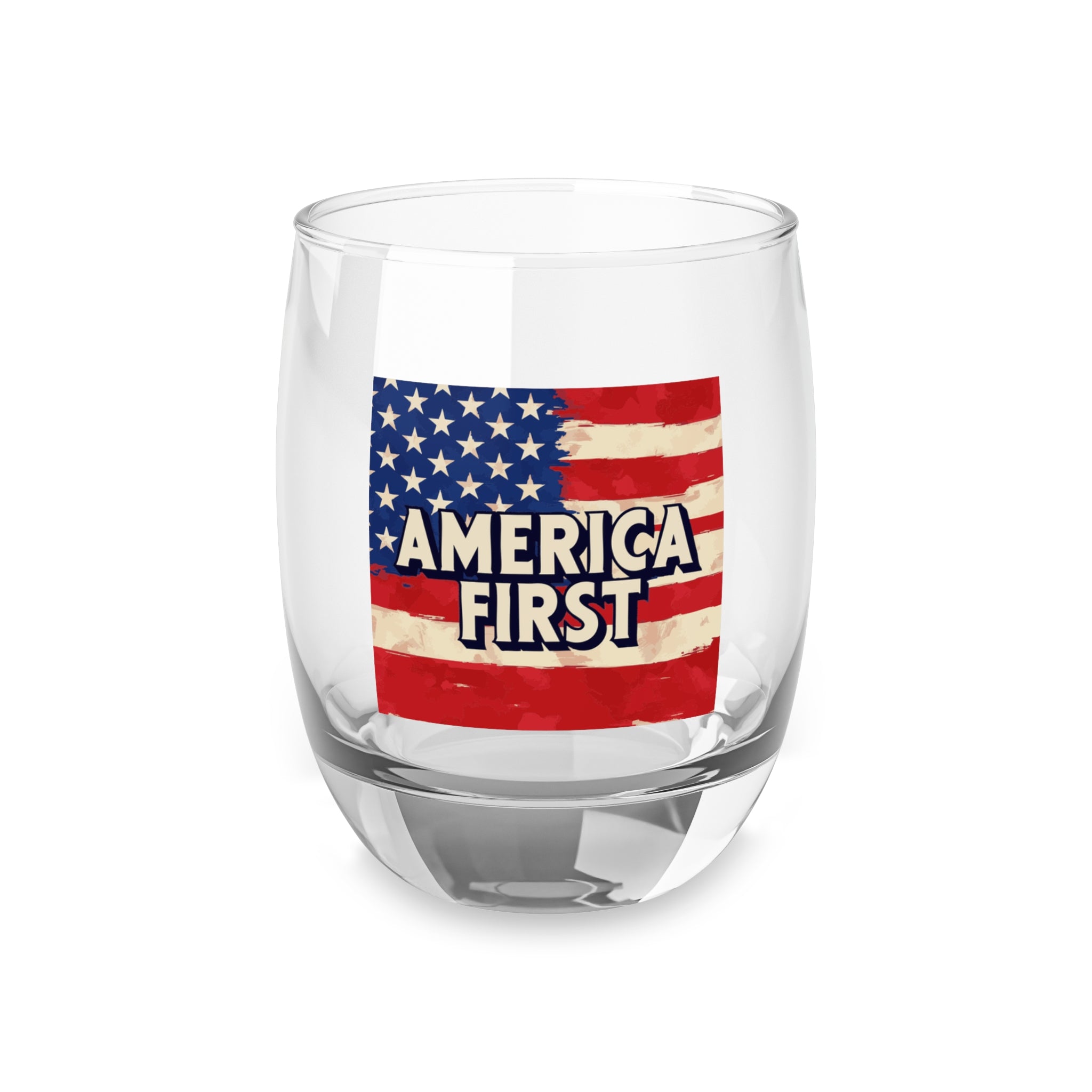 A clear whiskey glass with a 'America First' print featuring the American flag.