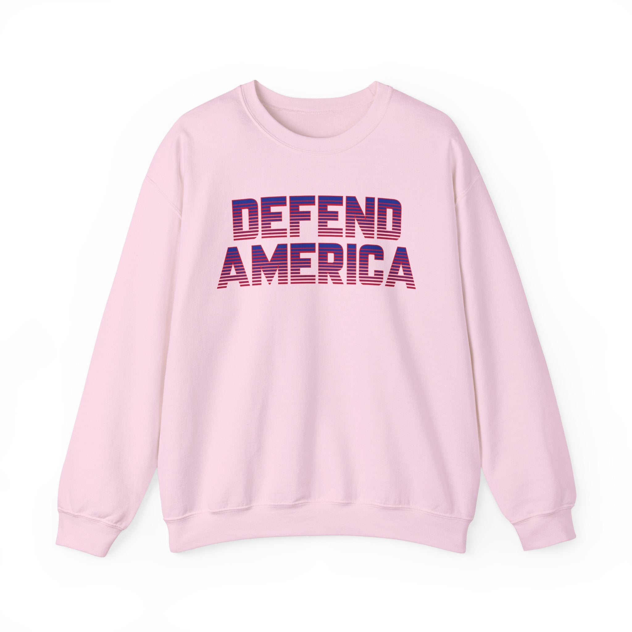 A pink unisex crewneck sweatshirt with 'DEFEND AMERICA' text in bold letters on the front.