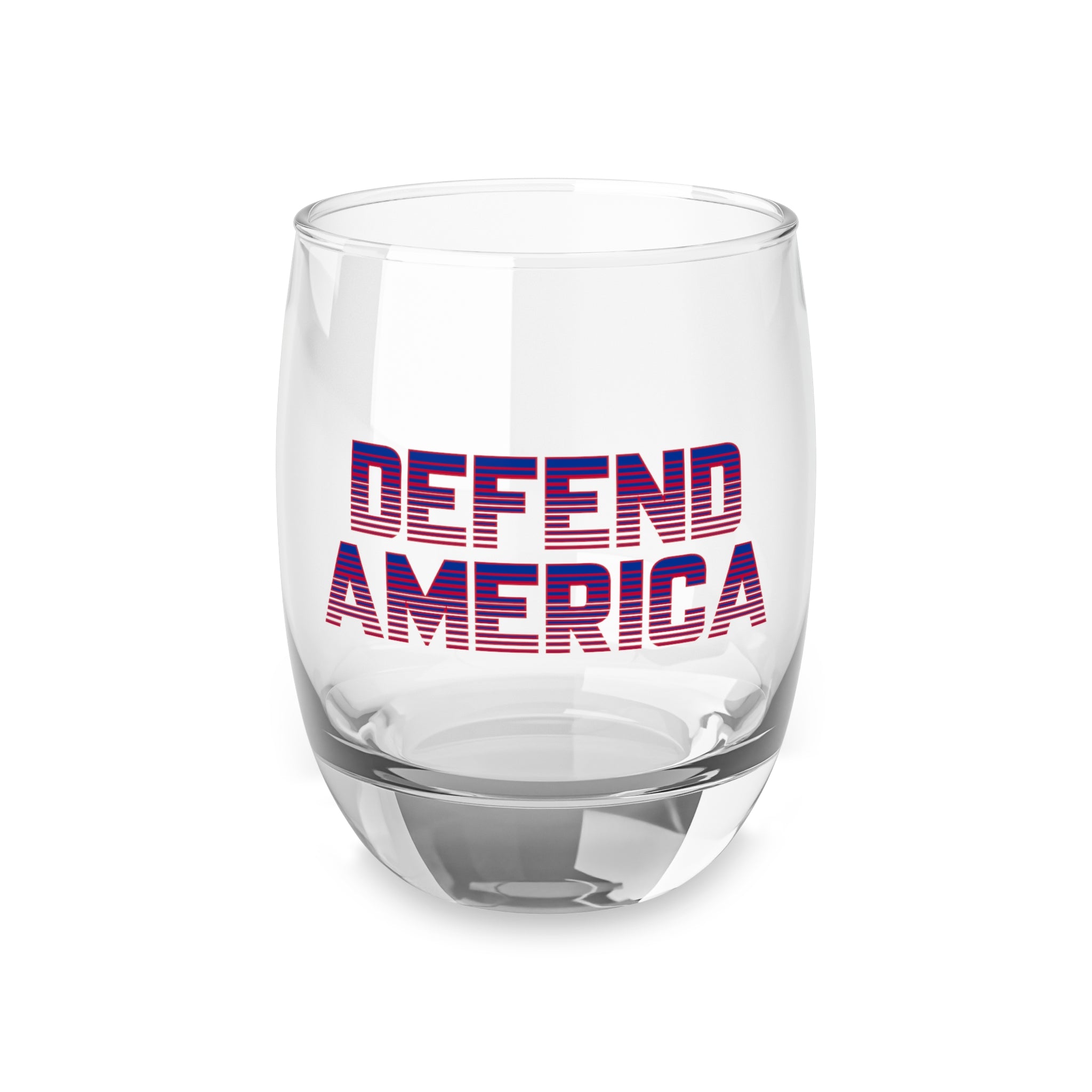 A clear whiskey glass with 'DEFEND AMERICA' printed in red and blue on the side.