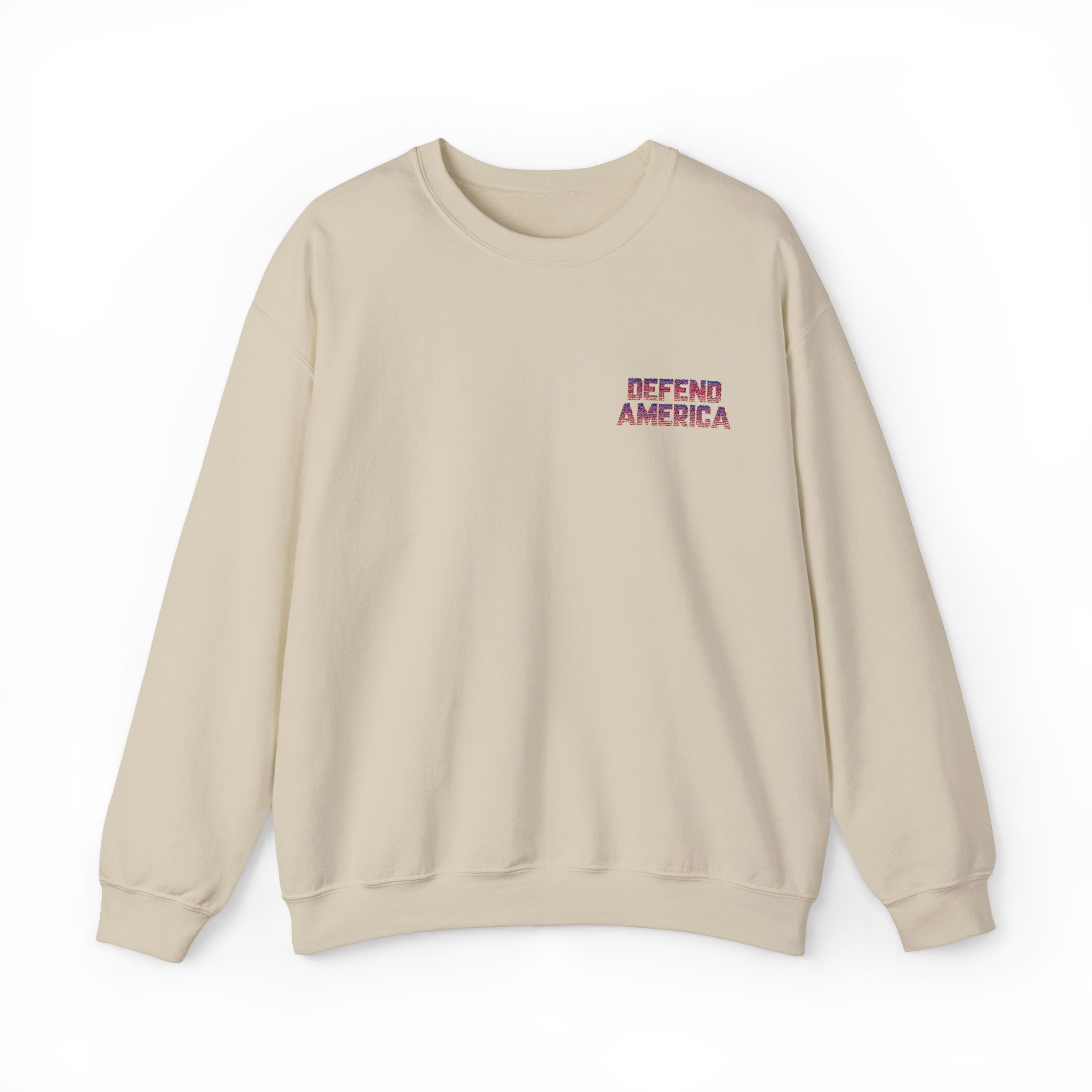 tan sand crewneck sweatshirt with 'DEFEND AMERICA EMBROIDERED CREWNECK SWEATSHIRT' text in red on the chest.