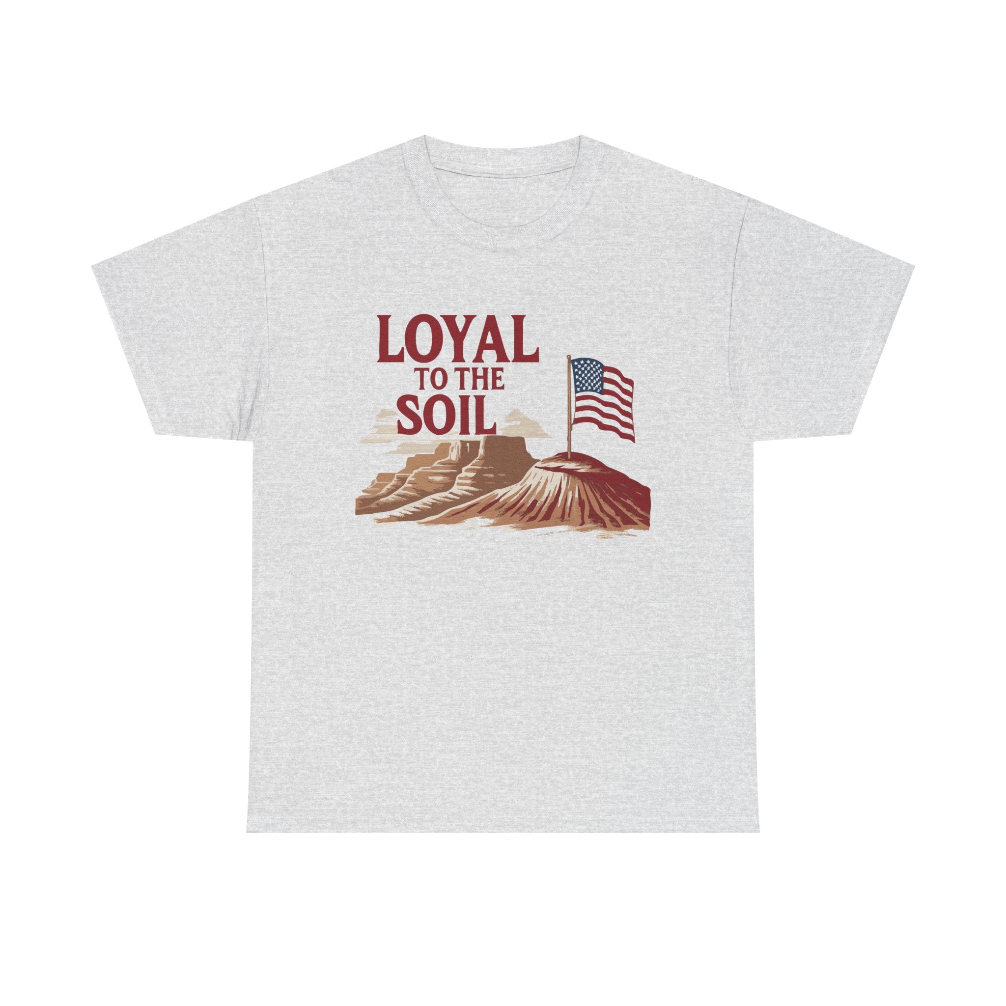 A gray unisex heavy cotton tee with a graphic print of the American flag and text 'LOYAL TO THE SOIL' on the front.