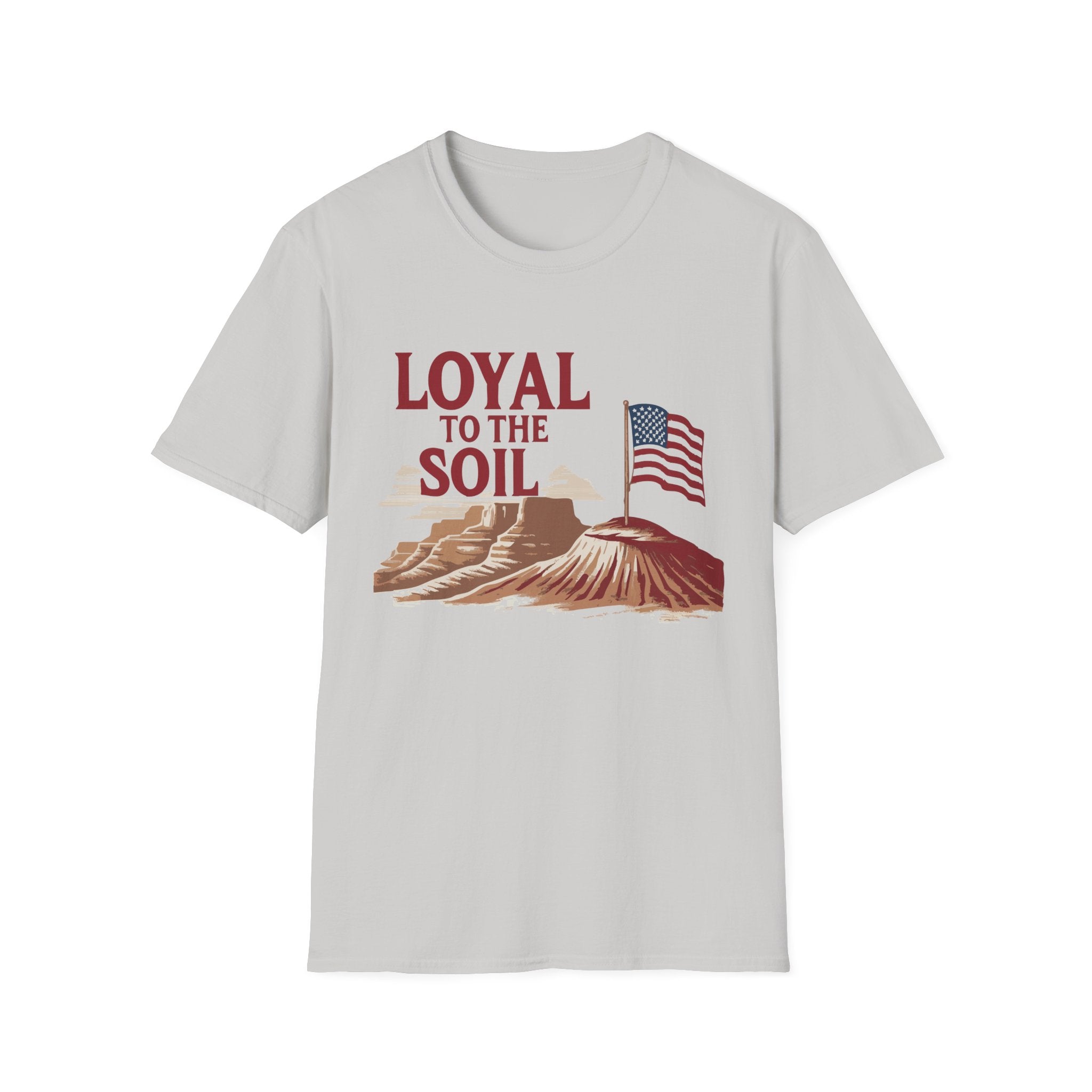 A gray unisex softstyle T-shirt with a graphic print that includes an American flag and the text 'LOYAL TO THE SOIL' on a design featuring a mountain range.