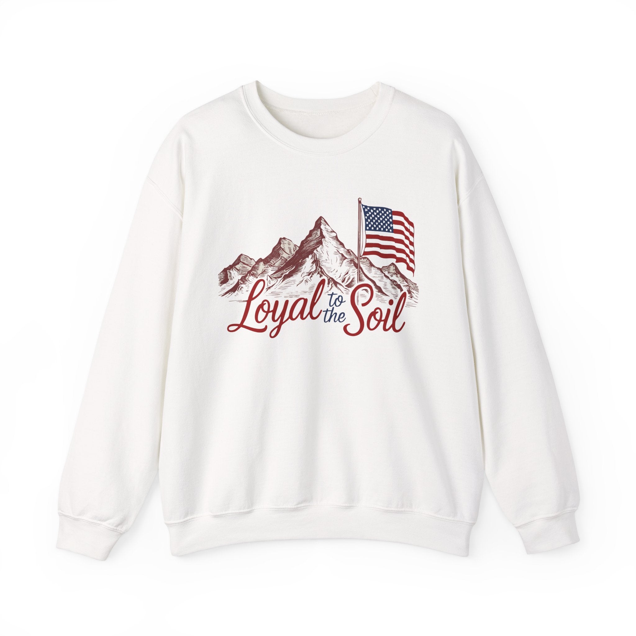 White crewneck sweatshirt with 'Loyal to the Soil' text and a mountain range design, featuring an American flag.