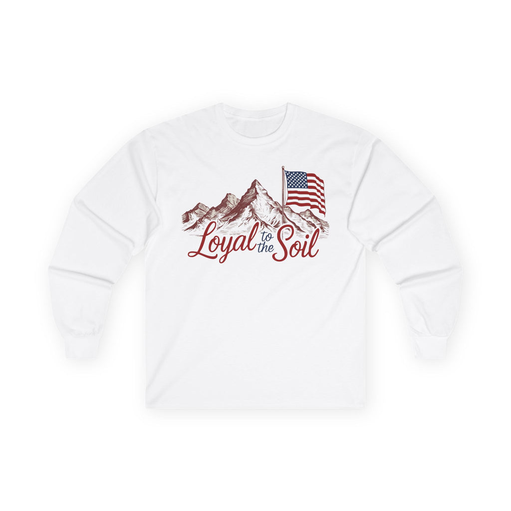 A long sleeve white t-shirt with a graphic print of a mountain range, an American flag, and the text 'Loyal to the Soil'.