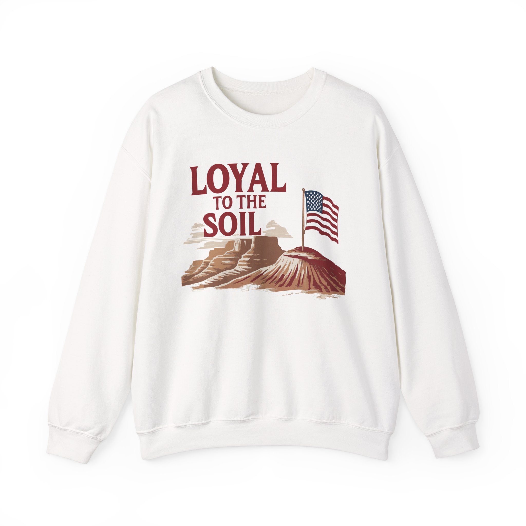 White unisex crewneck sweatshirt with a graphic print of the American flag and text 'LOYAL TO THE SOIL' on the front.