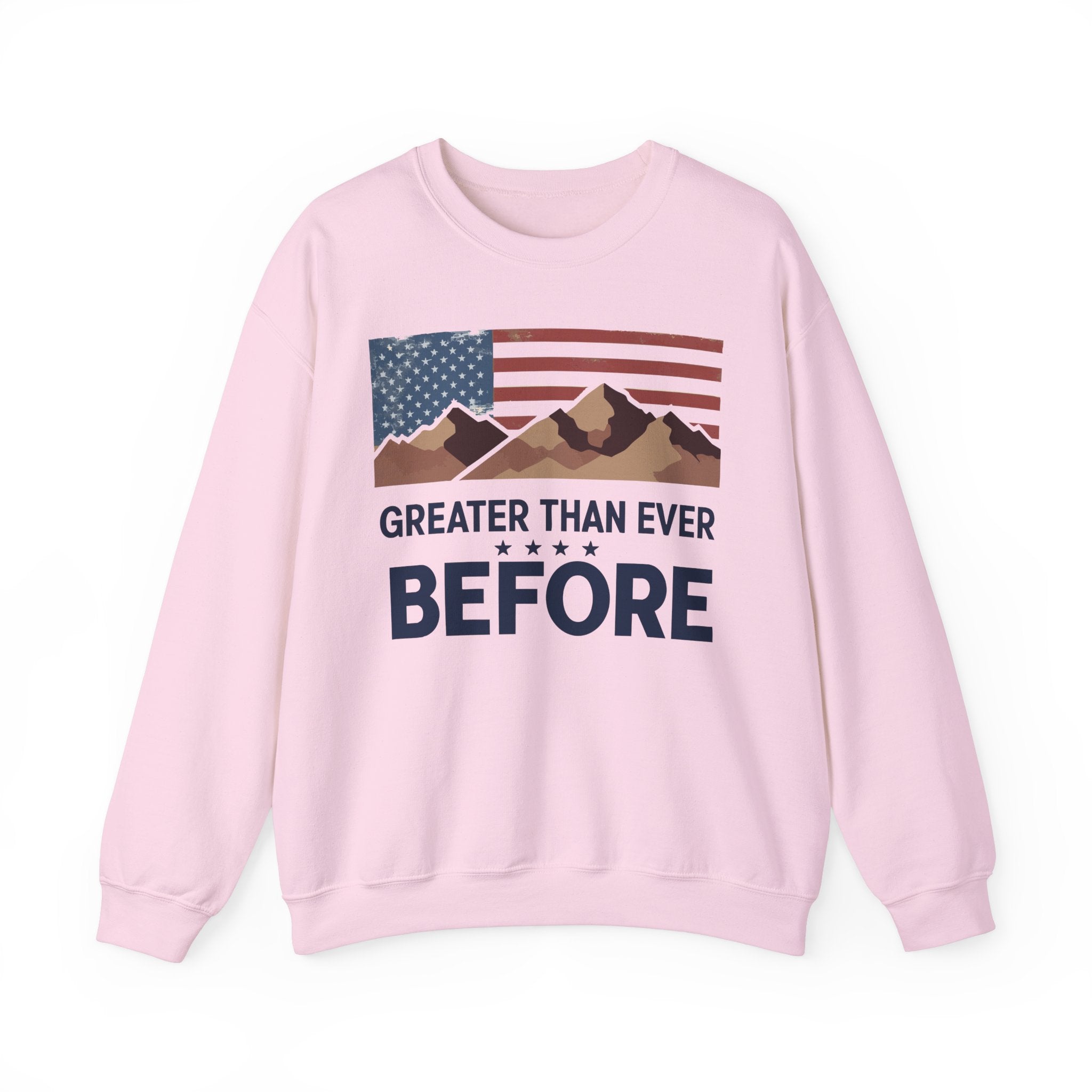 A pink crewneck sweatshirt with a graphic print of the American flag and mountains, and the text 'GREATER THAN EVER BEFORE'.